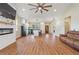 Open floor plan showcasing the kitchen, living room, and fireplace feature wall at 1042 Golden Bough Rd, Lake Wales, FL 33898