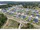 Aerial view of home showcasing the roof, surrounding properties and backyard at 1081 Sandpiper Loop, Winter Haven, FL 33881
