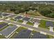 Overhead shot capturing the home's setting within a lush, green landscape and the neighborhood at 1081 Sandpiper Loop, Winter Haven, FL 33881