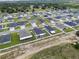 Aerial view of home showcasing the roof, surrounding properties and backyard at 1081 Sandpiper Loop, Winter Haven, FL 33881