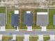 Aerial view of a home with a well-maintained lawn, a gray roof and an outlined boundary at 1081 Sandpiper Loop, Winter Haven, FL 33881