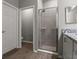 Stylish bathroom featuring granite countertops and a tiled shower at 1081 Sandpiper Loop, Winter Haven, FL 33881