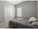 This is a bedroom featuring neutral walls, carpeted floor, and a window with blinds at 1081 Sandpiper Loop, Winter Haven, FL 33881