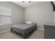 This is a bedroom featuring neutral walls, carpeted floor, and a window with blinds at 1081 Sandpiper Loop, Winter Haven, FL 33881