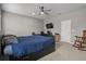 This is a spacious bedroom featuring neutral walls, a ceiling fan and large windows at 1081 Sandpiper Loop, Winter Haven, FL 33881