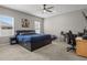 This is a spacious bedroom featuring neutral walls, a ceiling fan and large windows at 1081 Sandpiper Loop, Winter Haven, FL 33881