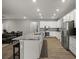 Bright kitchen with stainless steel appliances, granite countertops, and a large island at 1081 Sandpiper Loop, Winter Haven, FL 33881