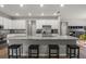 Spacious kitchen with a large island, granite countertops, and modern appliances at 1081 Sandpiper Loop, Winter Haven, FL 33881