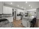 Bright, modern kitchen with white cabinetry, granite countertops, and stainless steel appliances at 1081 Sandpiper Loop, Winter Haven, FL 33881