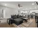 Open-concept living room with modern furnishings and connecting to the kitchen area at 1081 Sandpiper Loop, Winter Haven, FL 33881