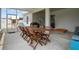 Covered patio with a large table and chairs with outdoor play area visible for outdoor fun at 1081 Sandpiper Loop, Winter Haven, FL 33881