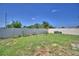 Spacious backyard featuring a well-maintained lawn and full perimeter fencing at 1100 Sugarwood St, Davenport, FL 33837