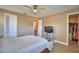 Relaxing bedroom features ceiling fan, with easy access to the walk-in closet at 1100 Sugarwood St, Davenport, FL 33837