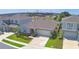 Exterior of home includes a well-manicured lawn, a two car garage, and a welcoming front entrance at 1100 Sugarwood St, Davenport, FL 33837
