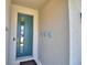 A modern front door entrance, with contemporary decor and a welcome mat at 1100 Sugarwood St, Davenport, FL 33837