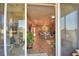 A view of the home's bright, open-concept living area as seen through the sliding patio doors at 1100 Sugarwood St, Davenport, FL 33837