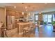 Open kitchen with stainless steel appliances, granite countertops and bar seating at 1100 Sugarwood St, Davenport, FL 33837