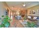 Inviting living room flows into kitchen with a large island and open floor plan at 1100 Sugarwood St, Davenport, FL 33837