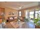 Cozy living room with tile floors, comfortable couches, and sliding door to the patio at 1100 Sugarwood St, Davenport, FL 33837