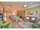 A spacious open-concept living room flows into the modern kitchen, complete with a cozy seating area at 1100 Sugarwood St, Davenport, FL 33837