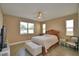 Relaxing main bedroom with lots of natural light and a ceiling fan at 1100 Sugarwood St, Davenport, FL 33837
