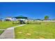 Outdoor community playground features modern equipment, a shaded canopy, and a safe play surface at 1100 Sugarwood St, Davenport, FL 33837