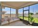 Serene screened patio with comfortable seating overlooking the fenced backyard at 1100 Sugarwood St, Davenport, FL 33837