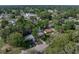 Aerial shot of the house highlighting the neighborhood and surrounding greenery at 1140 W Seminole Trl, Bartow, FL 33830