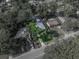 Aerial view of the home in the center of a lot surrounded by lush, green landscaping at 1140 W Seminole Trl, Bartow, FL 33830