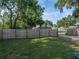 The backyard boasts a full fence, large trees, and plenty of green space at 1140 W Seminole Trl, Bartow, FL 33830