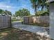 The fenced yard has a concrete pad and mature trees for shade at 1140 W Seminole Trl, Bartow, FL 33830
