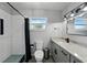 Bright bathroom features sleek vanity with granite countertops, modern fixtures, toilet and subway tile shower with glass door at 1140 W Seminole Trl, Bartow, FL 33830