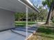 View from the carport showing decorative posts and a manicured lawn beyond at 1140 W Seminole Trl, Bartow, FL 33830