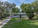 Charming single-story home with well-maintained lawn, inviting curb appeal, and a cozy carport at 1140 W Seminole Trl, Bartow, FL 33830