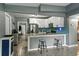 Bright kitchen with white cabinets, modern appliances, breakfast bar, and stainless steel features at 1140 W Seminole Trl, Bartow, FL 33830