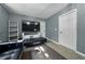 Bright living room featuring wood-look flooring and a convenient hall closet at 1140 W Seminole Trl, Bartow, FL 33830