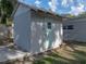 Exterior shot of the shed with freshly painted lap siding and a small window in the back at 1140 W Seminole Trl, Bartow, FL 33830