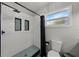 Shower with blue mosaic floor, subway tile and black trim, black hardware and a black shower curtain at 1140 W Seminole Trl, Bartow, FL 33830