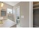 Bathroom with a vanity, sink, toilet, closet, and a window allowing natural light, creating a tidy and functional space at 118 Browning Cir, Winter Haven, FL 33884