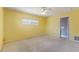 Cozy bedroom with carpet, ceiling fan, and natural light, providing a comfortable and relaxing atmosphere at 118 Browning Cir, Winter Haven, FL 33884
