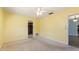 Bedroom featuring carpet, closet, and ceiling fan, offering a comfortable and functional living space at 118 Browning Cir, Winter Haven, FL 33884