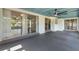 Large enclosed lanai with a ceiling fan provides additional entertaining or relaxation space at 118 Browning Cir, Winter Haven, FL 33884
