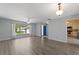 Open-concept living area boasts modern flooring, neutral colors, and great flow to the kitchen at 118 Browning Cir, Winter Haven, FL 33884