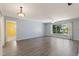 Bright and spacious living room featuring modern floors, neutral paint, and ample natural light at 118 Browning Cir, Winter Haven, FL 33884
