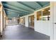 Bright sunroom with sliding doors and turquoise ceiling, perfect for relaxation and enjoying natural light at 118 Browning Cir, Winter Haven, FL 33884