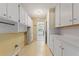 Practical utility room with ample cabinet storage for organizing household essentials at 118 Browning Cir, Winter Haven, FL 33884