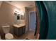 Bathroom featuring vanity, mirror, and tiled floors at 12241 Augusta Woods Cir, Orlando, FL 32824
