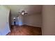 Bedroom featuring hardwood floors, a ceiling fan, closet, and plenty of natural light at 12241 Augusta Woods Cir, Orlando, FL 32824