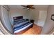 Bedroom with ceiling fan, laminate flooring, neutral walls and good natural light at 12241 Augusta Woods Cir, Orlando, FL 32824
