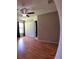 Bedroom featuring hardwood floors, a ceiling fan, closet, and plenty of natural light at 12241 Augusta Woods Cir, Orlando, FL 32824